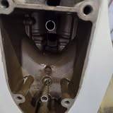 Looking down into a white outboard midsection with the powerhead removed