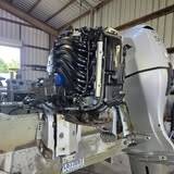 Same twin outboards from another angle, the left engine with its cowling off